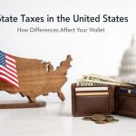 Leather wallet filled with U.S. dollar bills and credit cards, placed on a clean surface alongside loose coins, with a wooden map of the United States and an American flag in the background, symbolizing how state tax differences influence personal finances and household budgets across the United States.